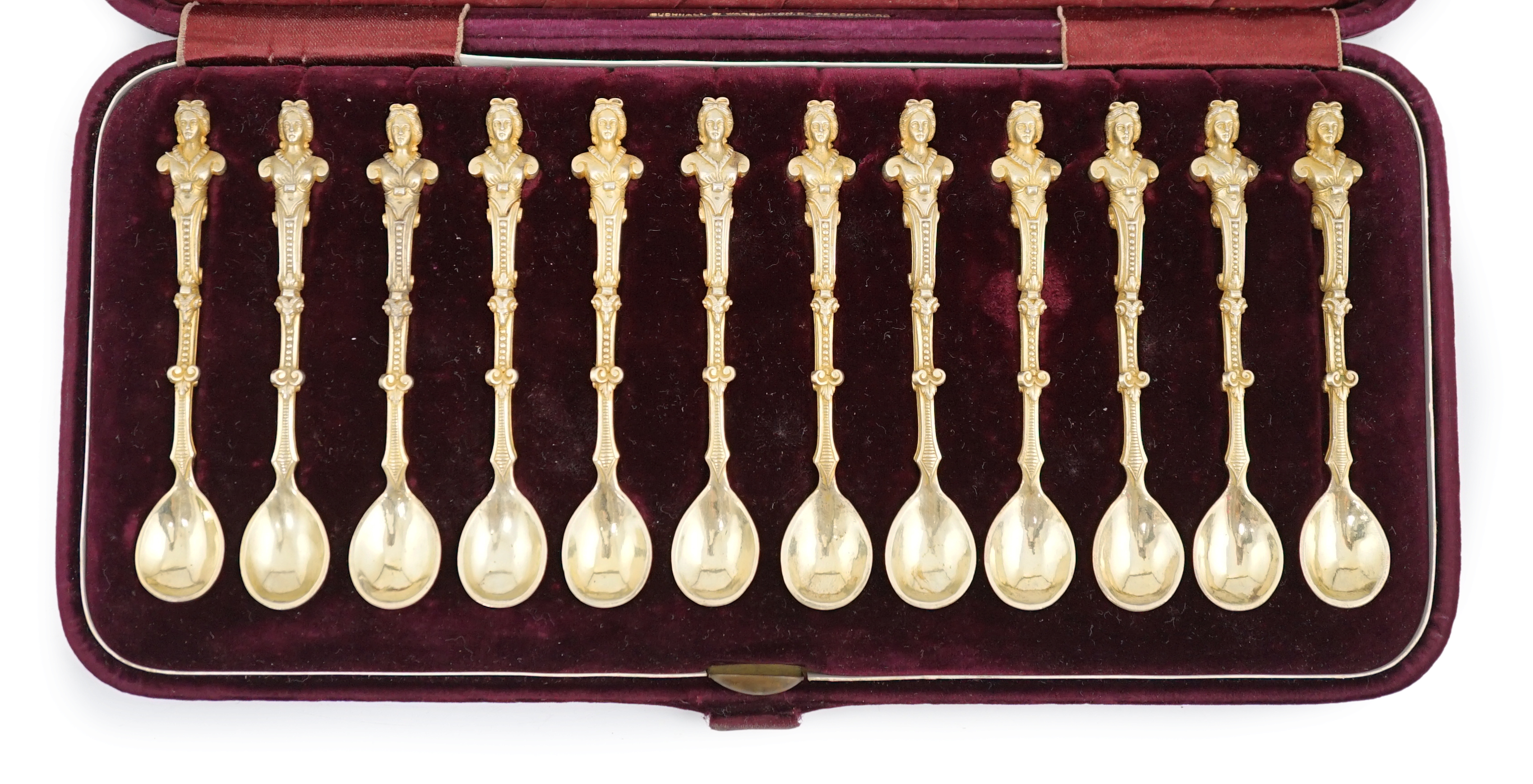 A cased set of twelve late 19th century Russian 84 zolotnik silver gilt caviar spoons by F.E. Henriksen, St. Petersburg